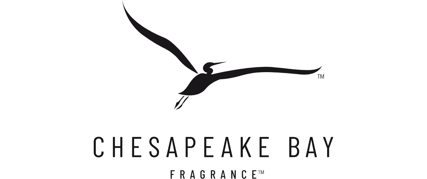 Logo in black on white, laid out wide: a stylised long-winged heron in flight above the words CHESAPEAKE BAY in widely spaced capitals, with FRAGRANCE in smaller letters beneath.