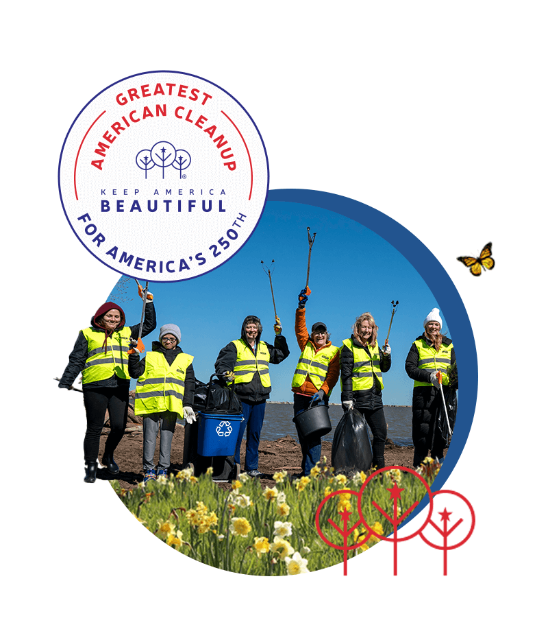 Composite graphic: six women in yellow hi-vis vests raise litter grabbers on a shoreline under blue sky, framed in a circle with daffodils across the foreground, a monarch butterfly at the right and red line-drawn trees at the base. A GREATEST AMERICAN CLEANUP, FOR AMERICA'S 250TH badge sits at the top left.