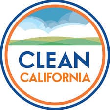 Circular logo with an orange and navy ring around a simple illustration of green rolling hills under a blue sky, with the words CLEAN CALIFORNIA in navy and orange across the centre.