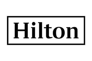 Small monochrome brand mark showing Hilton in serif capitals and lower case, boxed by a narrow black rectangle on white.