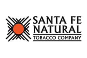 Wide white logo panel with a black spiked sun motif and orange centre at the left and SANTA FE NATURAL TOBACCO COMPANY set in three lines to its right.