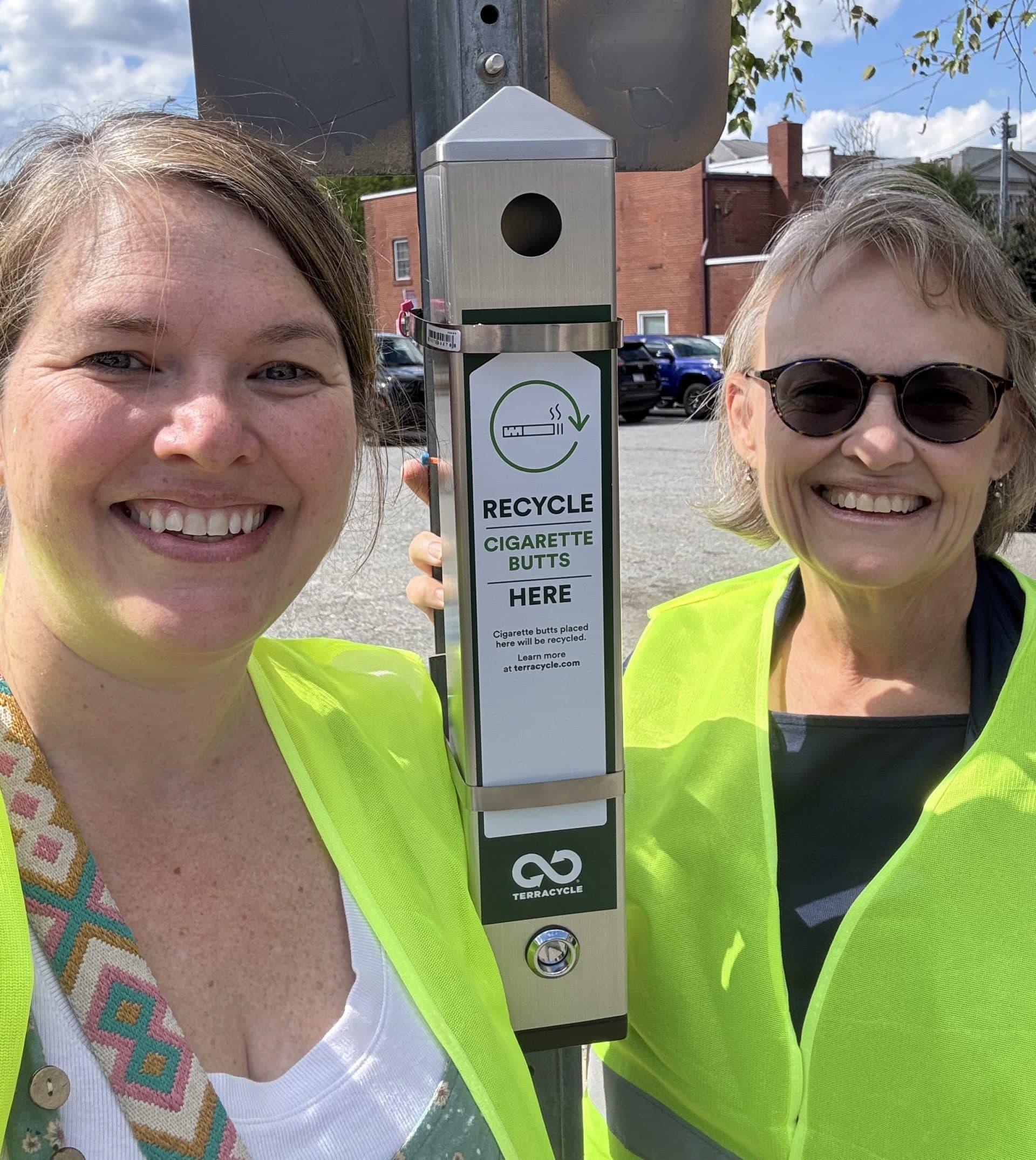 Keep Greensboro Beautiful volunteers documenting a cigarette-litter prevention site as part of the program's interim reporting.